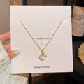 Collier Doré motif Lune + Étoile diamant